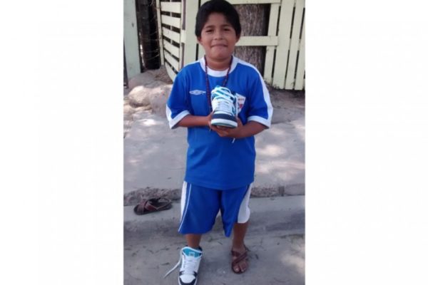 Student, Juan Garcia showing off his new pair of shoes!